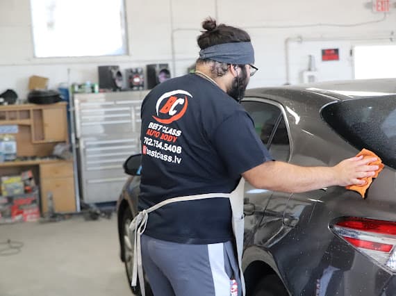 Buffing technician finishing vehicle surface at Best Class Auto Body Las Vegas