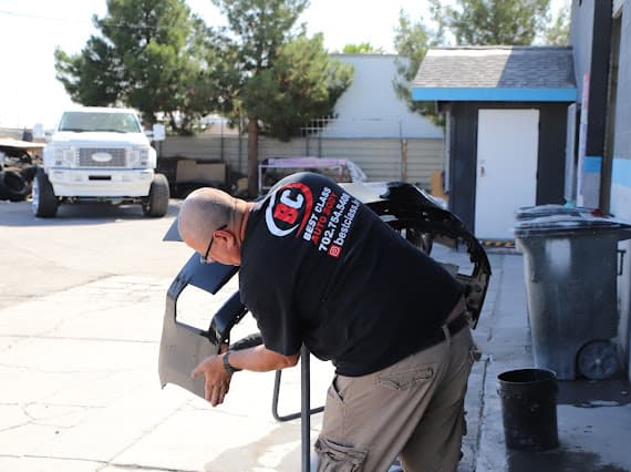 Auto body technician performing bodywork repair at Best Class Auto Body Las Vegas NV