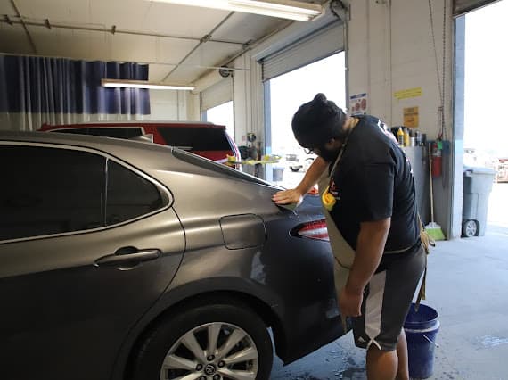 Auto body technician working inside Best Class Auto Body shop Las Vegas