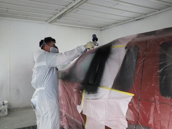 Technician in paint booth at Best Class Auto Body Las Vegas